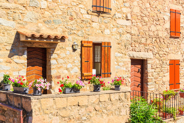 Facade of typical French stone houses in Piana village, Corsica island, France