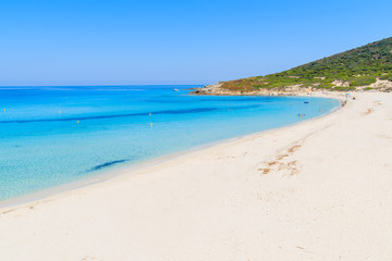 Fototapeta na wymiar Stunning sandy Bodri beach near L'lle Rousse with azure sea water, Corsica island, France
