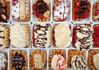 Street Waffles Decorated with Strawberries Chocolates and Cream in Brussels of Belgium
