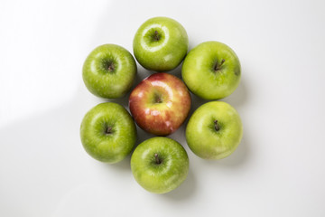 Some green apples on a white background