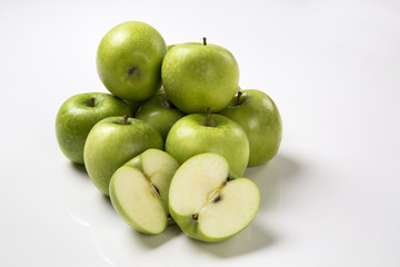 Some green apples on a white background
