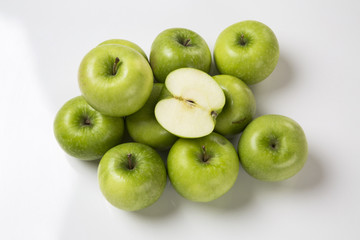 Some green apples on a white background