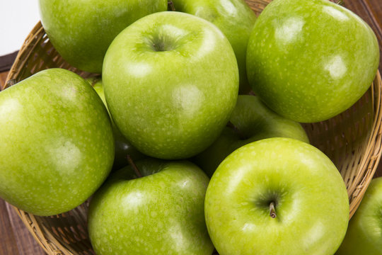 Some green apples on a white background