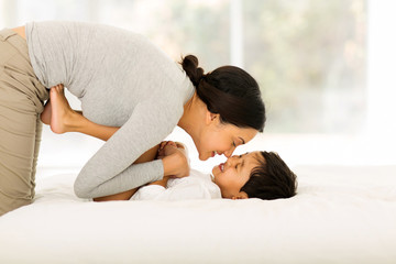 indian mother playing with her little boy