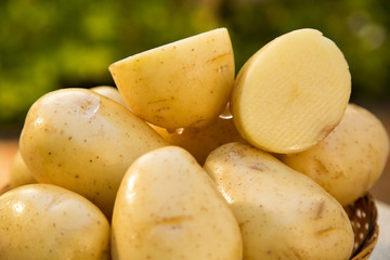 Some potatoes over a wooden surface