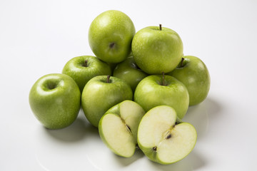 Some green apples on a white background