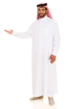 arabian man showing empty space
