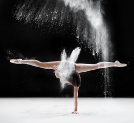 Obraz na płótnie Canvas ballerina dancing with flour