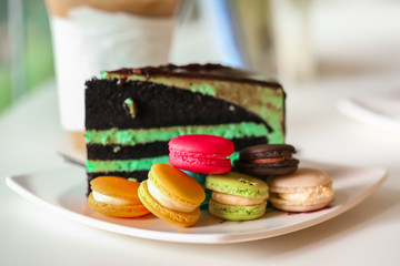 traditional french colorful macarons and Chocolate Mint cake