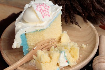 White cream cake delicious on wood background