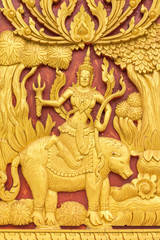 Wood carvings, gold On a red background in temple ,Thailand
