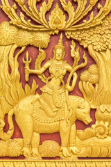 Wood carvings, gold On a red background in temple ,Thailand