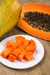 Fresh cut juicy tropical papaya mamao fruit with seeds at Brazil