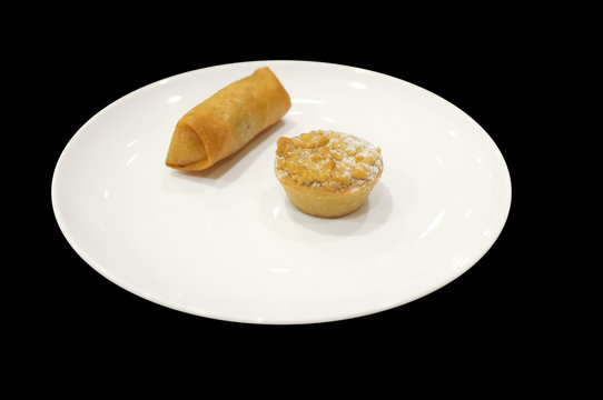 Appetizer Sampler With Spring Roll And Tart On White Dish