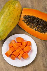 Fresh cut juicy tropical papaya mamao fruit with seeds at Brazil