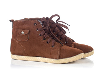 Pair of old Brown working boots with shadows