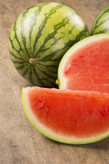 slices of watermelon on wooden table