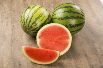 slices of watermelon on wooden table