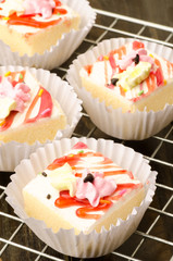 Vanilla cream cake arranged on the rack, delicious dessert