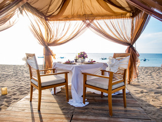 Romantic dinner setting on the beach