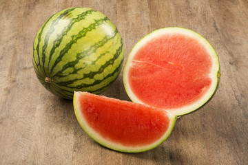 slices of watermelon on wooden table