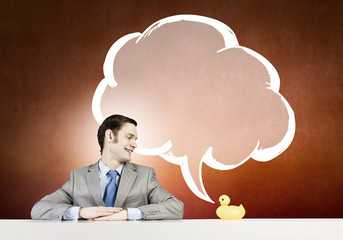 Businessman with duck