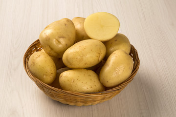Fototapeta na wymiar Some potatoes over a white background