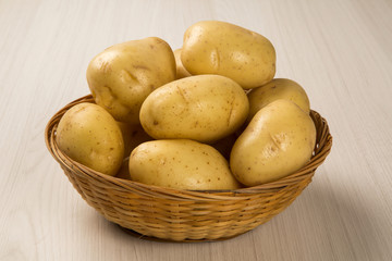 Some potatoes over a white background