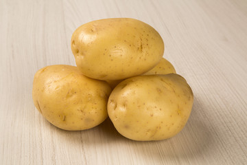 Some potatoes over a white background