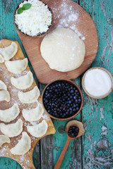 Uncooked dumplings with blueberries