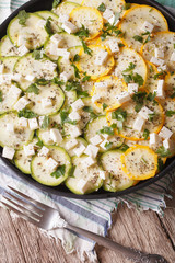 Homemade carpaccio of zucchini with cheese close-up. vertical top view
