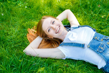 Beautiful smiling red-haired young woman