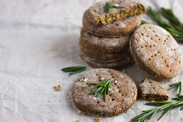 Finnish rye flat bread on rustic background