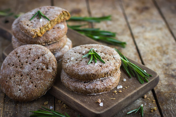 Finnish rye flat bread on rustic background