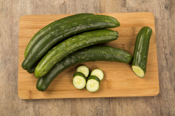 Fresh cucumber on the wooden table