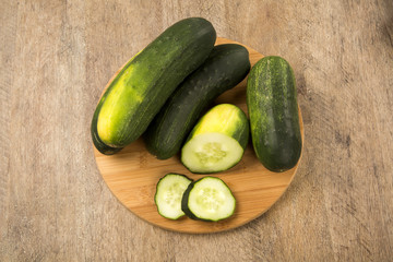 Fresh cucumber on the wooden table
