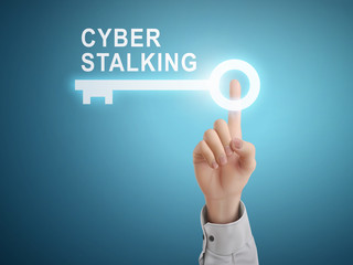 male hand pressing cyber stalking key button