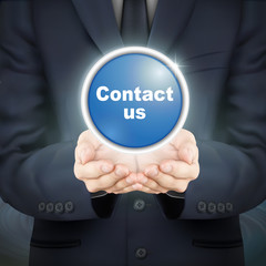 businessman holding contact us icon