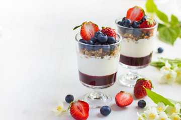 dessert with  berries,  cream cheese, granola  and berries  jam