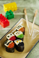 sushi with flying fish caviar, nori, rice. funny food for kids. children japanese menu