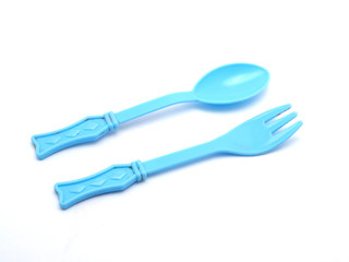 Plastic baby spoon on a white background