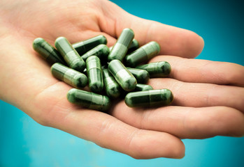 Medical pills on hand/ Selective focus and Close up