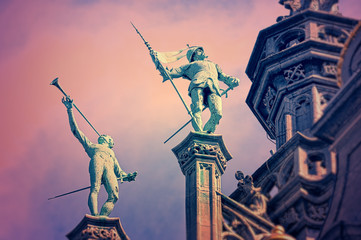 Statues on the roof of King's House or Maison du Roi on Grand Place in Brussels, with vintage look effects applied - 87494523