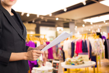 Businesswoman reading a business document.