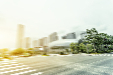 Blurred motion of modern skyline and urban street