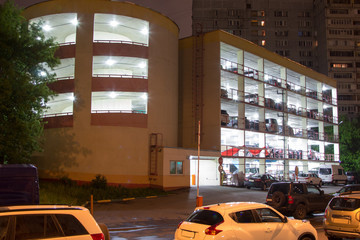 multistory brightly lit parking lot at night