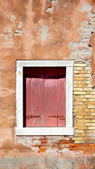 red wood window and ancient decay wall