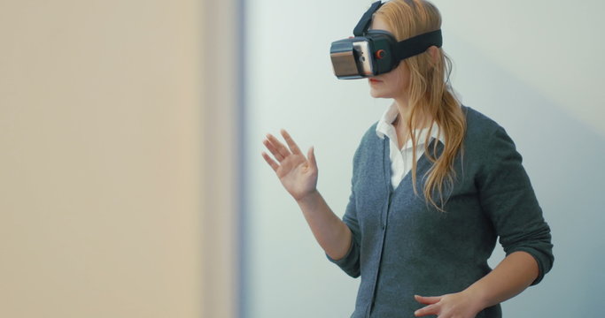 Woman entertaining with VR-headset for mobiles