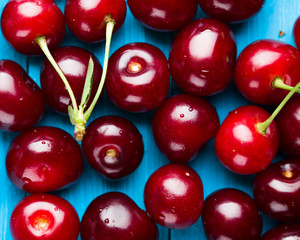 Cherries on a blue wooden background