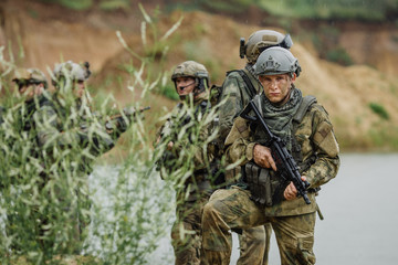 Portrait of a ranger in the battlefield with a gun